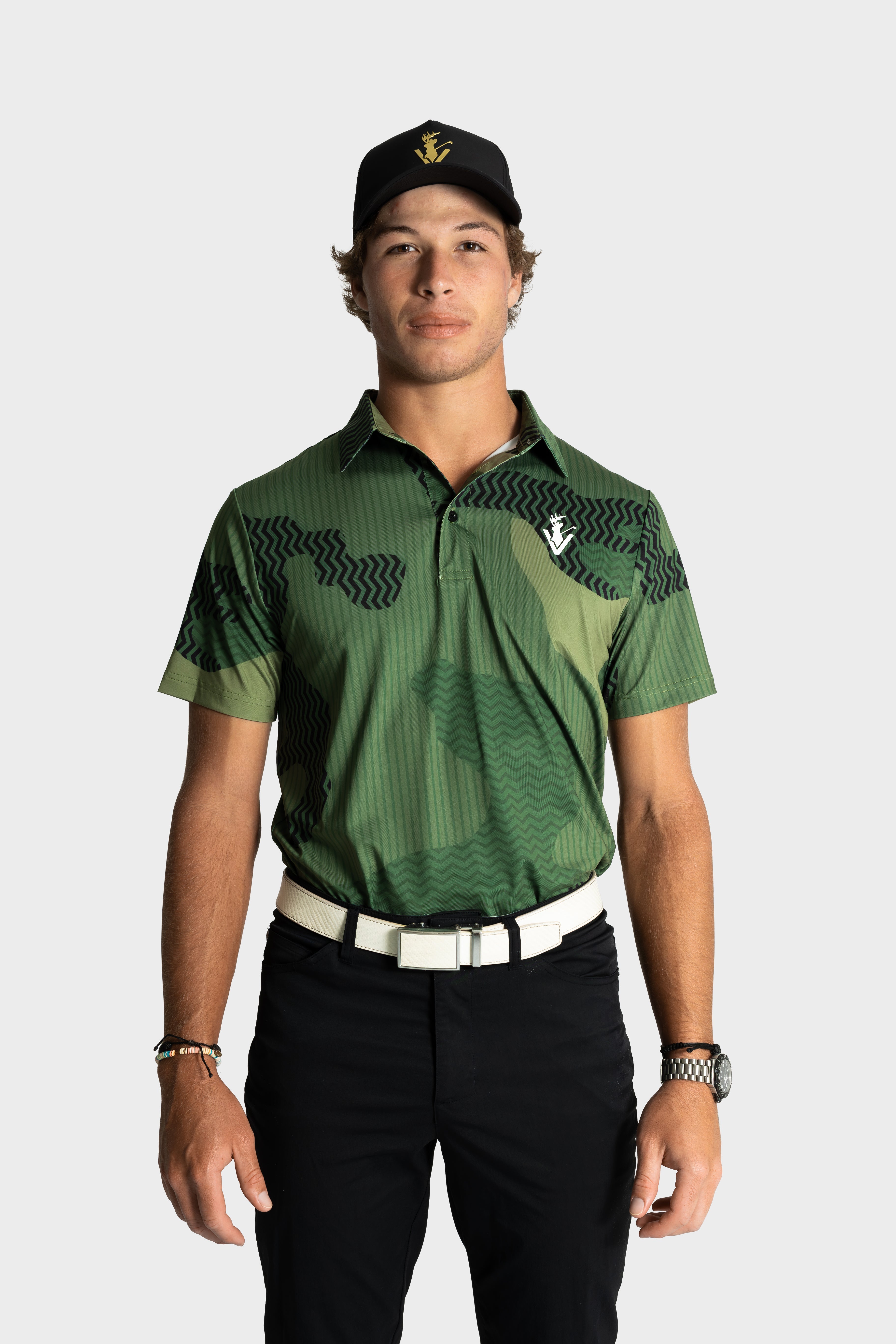 Man wearing green camouflage VittoriaGolfco polo shirt and black cap on white background