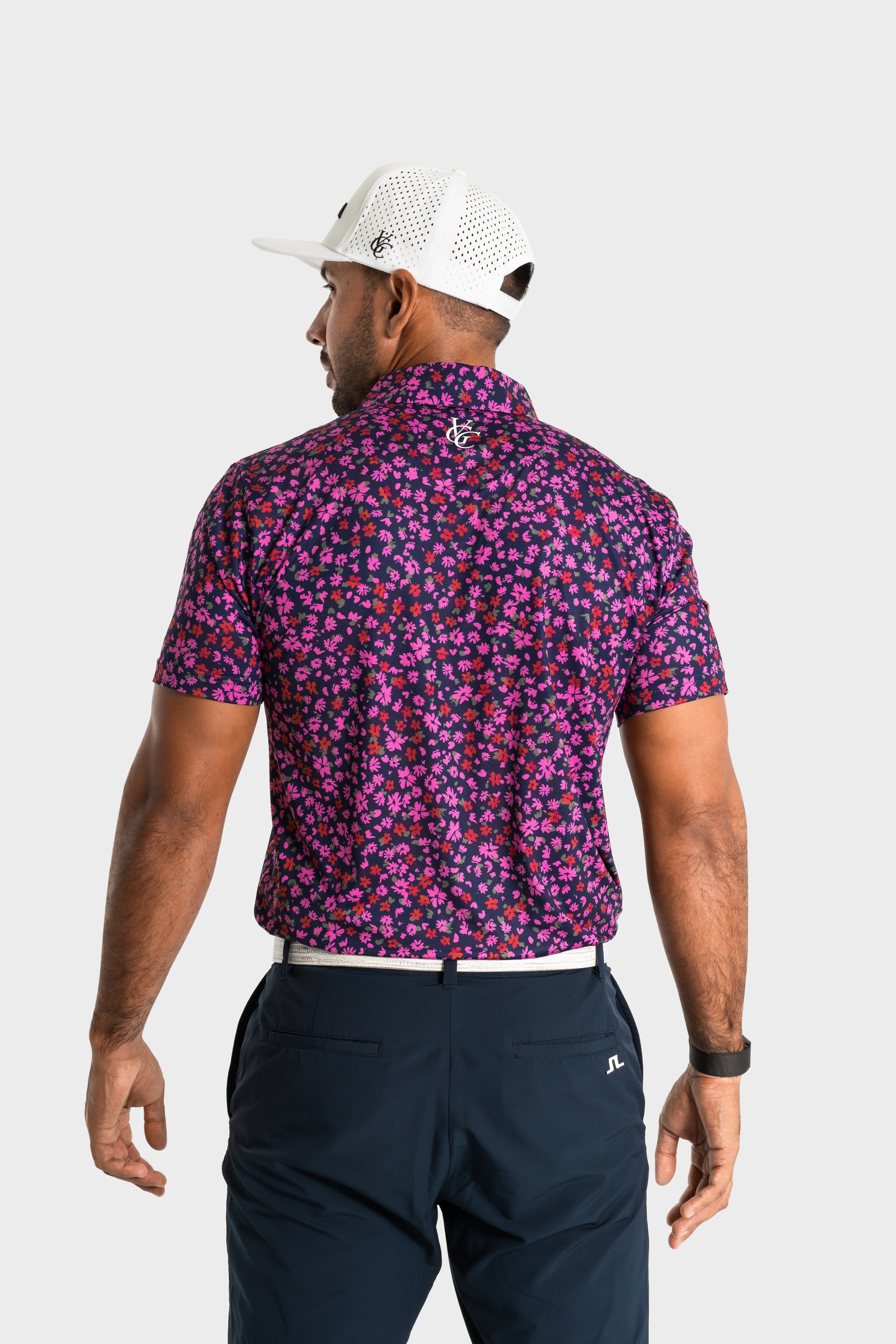 The Secret Garden polo shirt with purple floral pattern by VittoriaGolfco