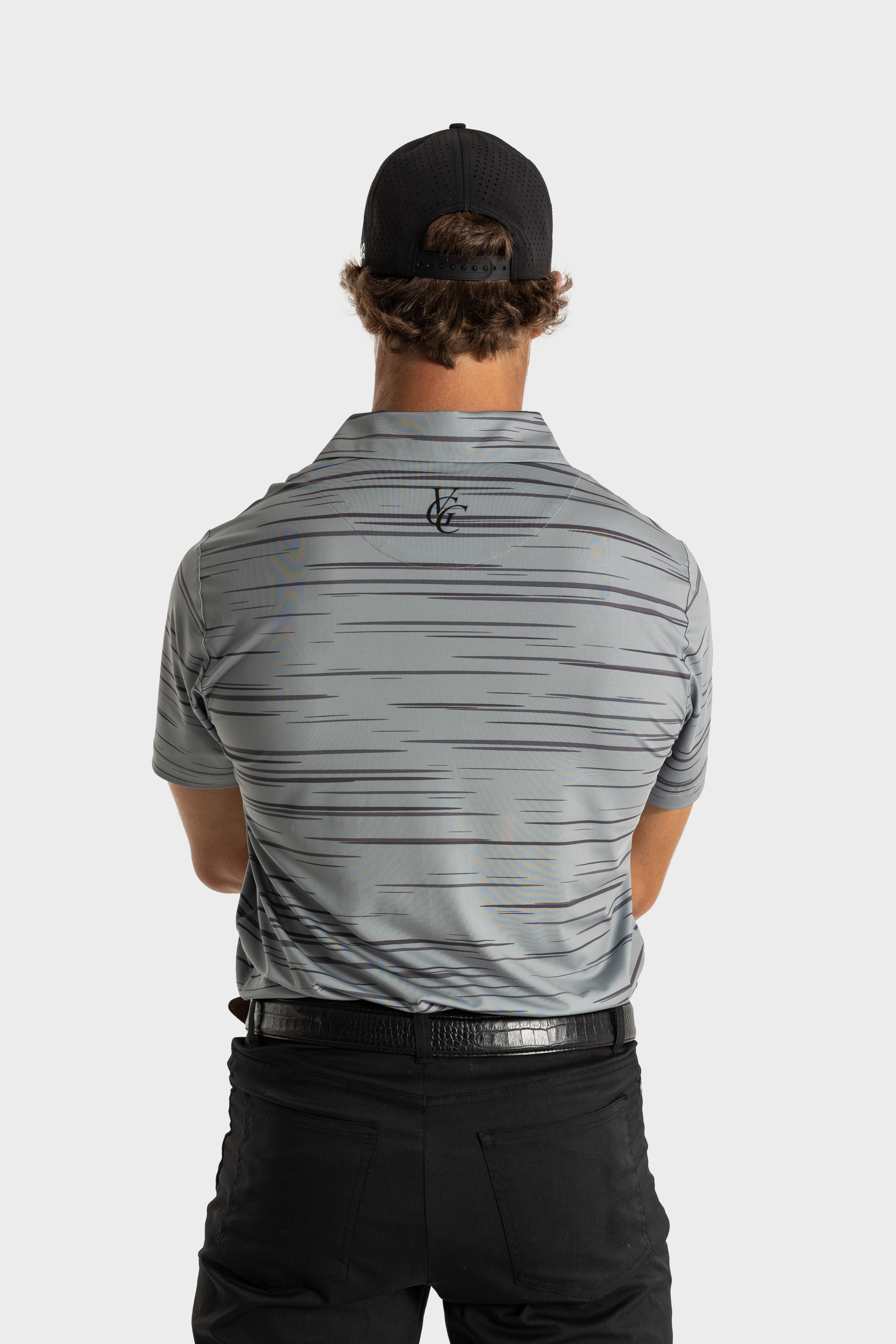Back view of man wearing The Gray polo by VittoriaGolfco with subtle horizontal stripe pattern and black cap