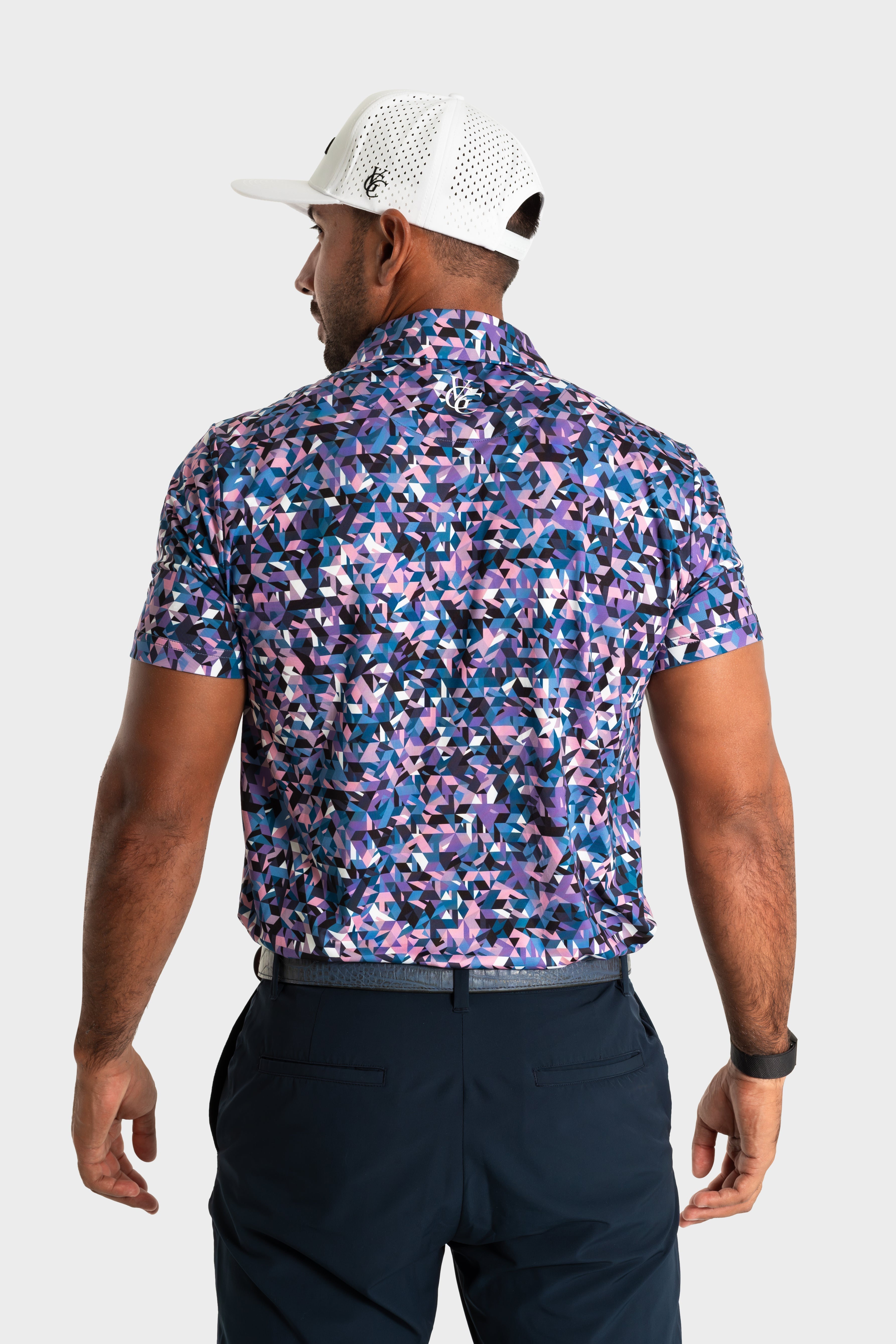 The Geo polo with bold geometric pattern worn by man from back view