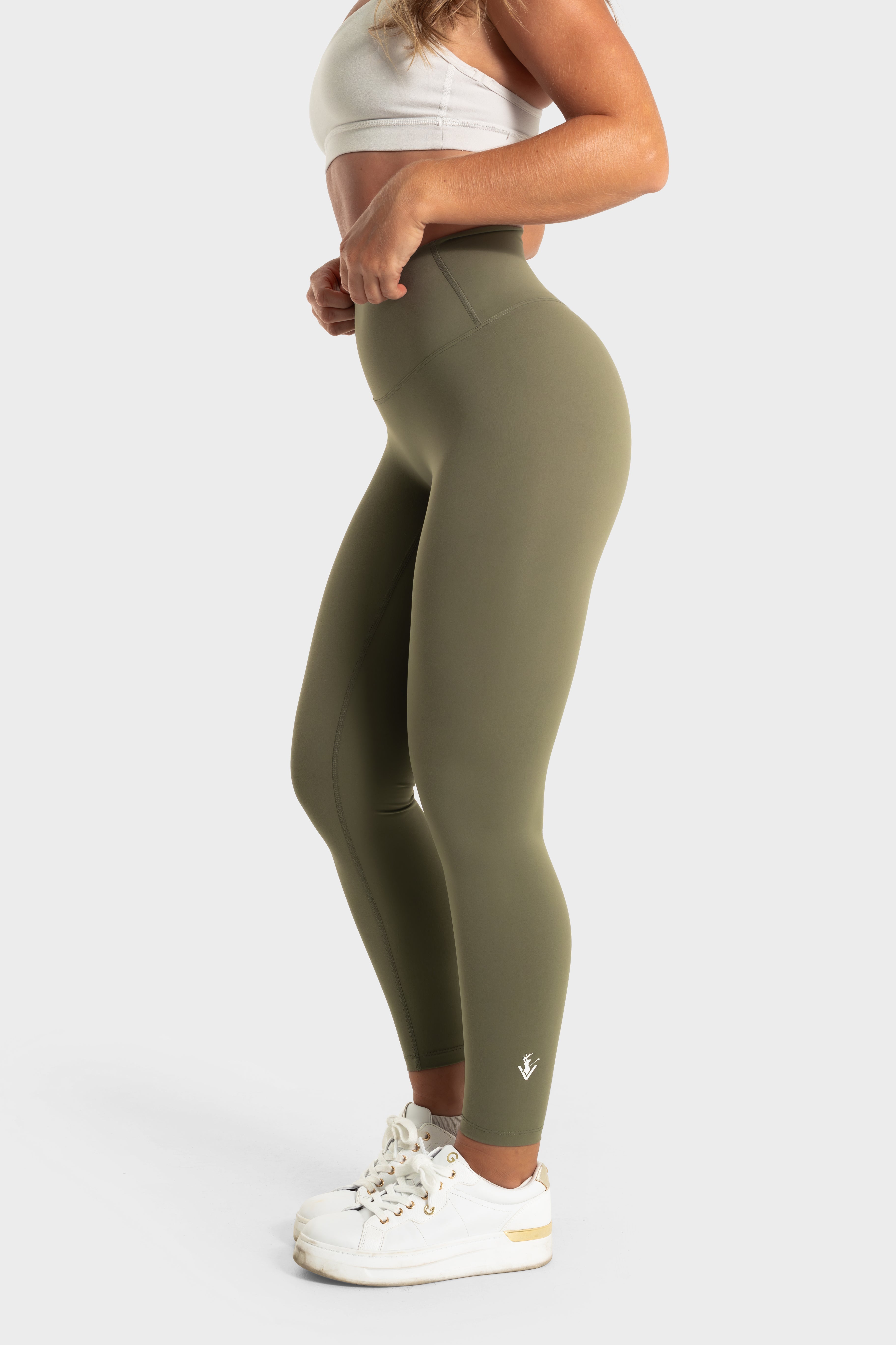 The Quelles olive green high-waisted leggings designed for comfort, flexibility, and moisture-wicking performance by VittoriaGolfCo