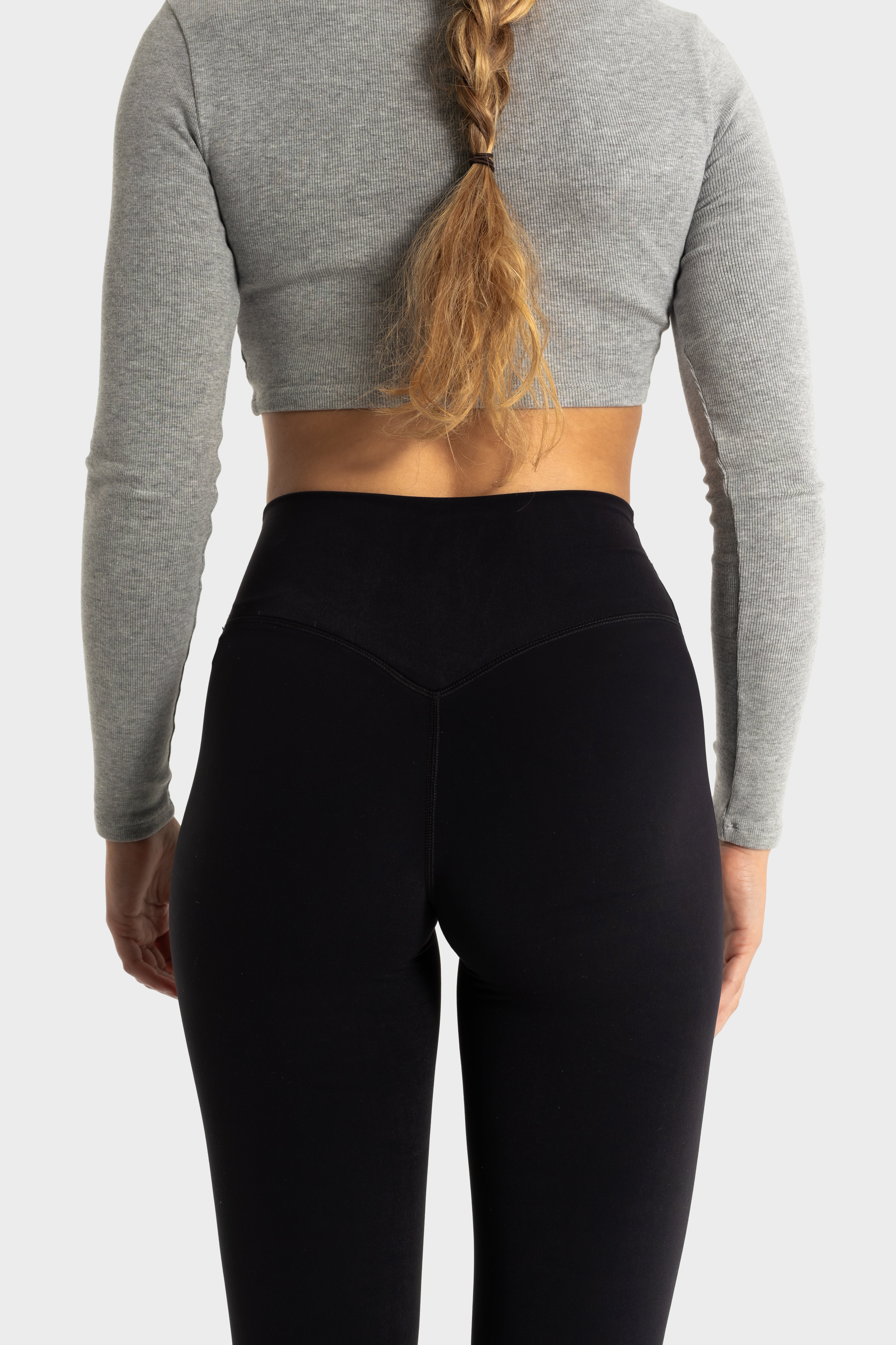 Back view of Sollevare leggings showcasing contouring lift and support with a high-waist design