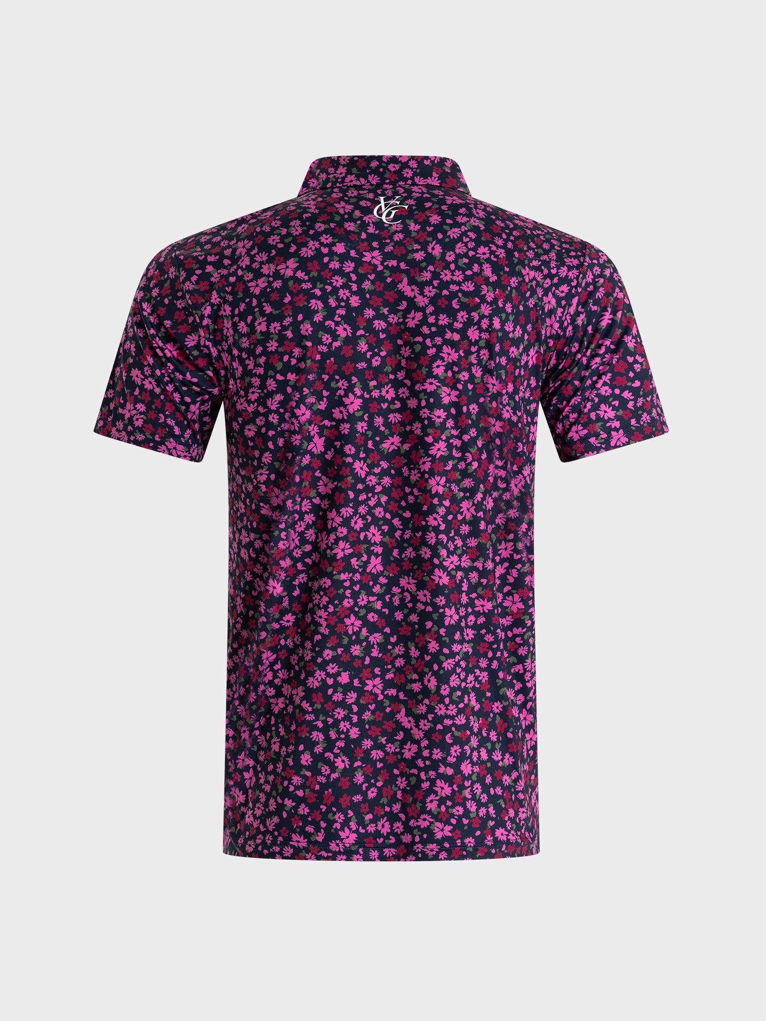 The Secret Garden polo shirt by VittoriaGolfco with a dark base and vibrant pink floral pattern