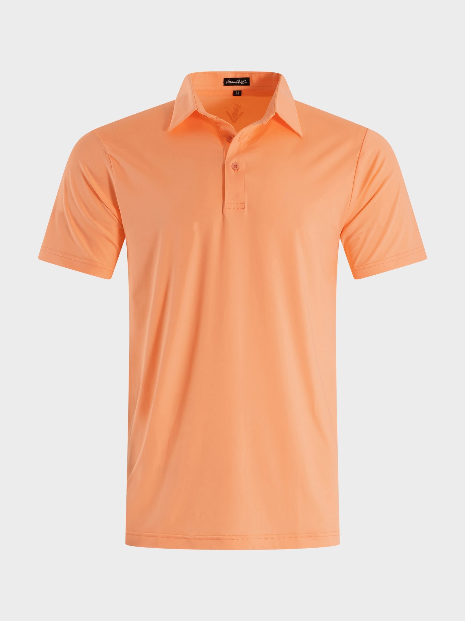 Peach-colored breathable golf polo shirt named The Dawn with a modern cut from VittoriaGolfCo Solids Collection
