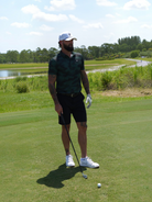 Golfer wearing Vapor Flex The Cypress polo on golf course