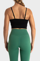 The Quelles green high-waisted leggings by VittoriaGolfCo shown from back with black crop top