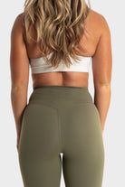The Quelles olive green leggings designed for comfort, flexibility, and moisture-wicking performance by VittoriaGolfCo.