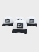 Two Tone Cotton Hat with classic black and white design, breathable cotton fabric, and adjustable snap back strap for golf and casual wear